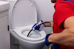 When to Call a Plumber About Your Clogged Toilet